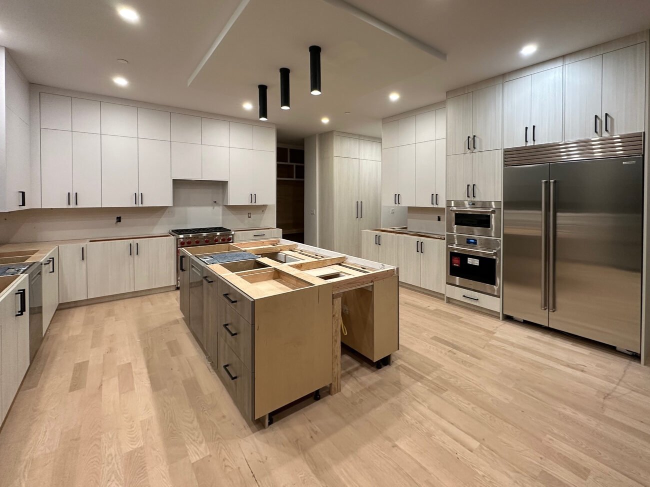 custom slab front cabinets in a modern chef's kitchen